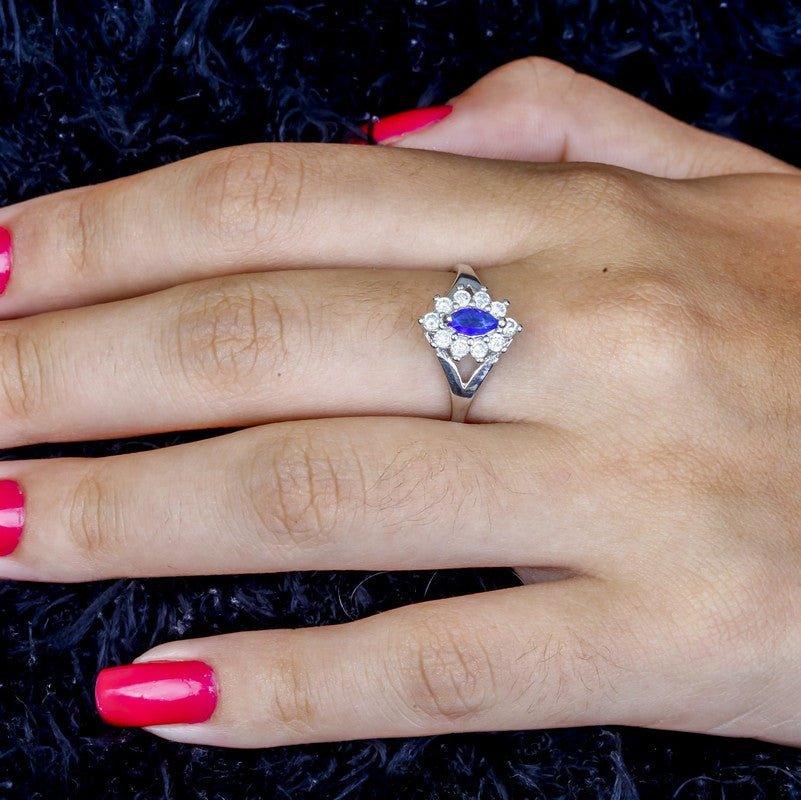 Anel Thalia com zirconias safira e brancas folheado a rodio