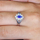 Anel Thalia com zirconias safira e brancas folheado a rodio