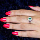 Anel Thalia zirconias brancas e esmeralda folheado a rodio