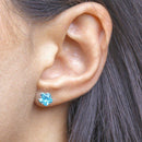 Brinco Flora flor zirconia azul folheado a rodio