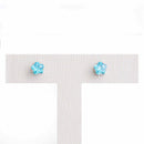 Brinco Flora flor zirconia azul folheado a rodio